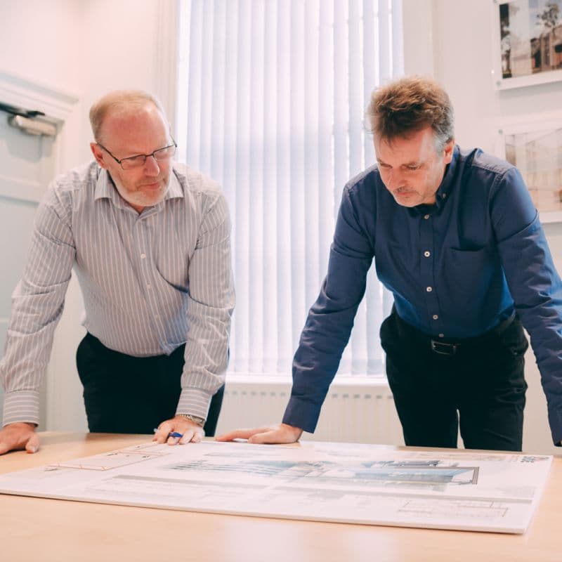 Two architects reviewing drawings